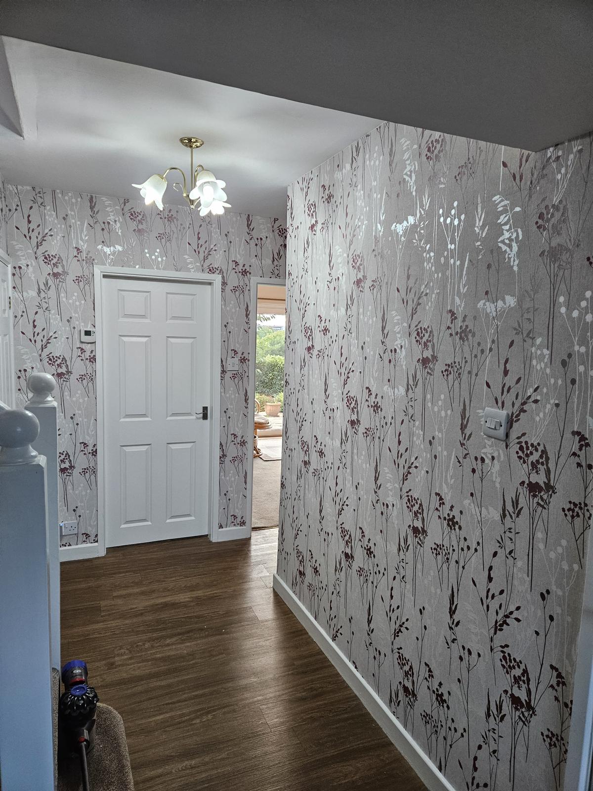 Freshly wallpapered hallway in a bright modern living room